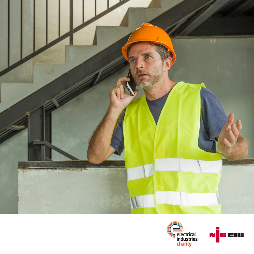 NICEIC registered contractor making a phone call.