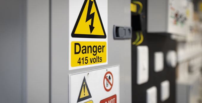 Electrical training appliances used to reference on training courses. A yellow Danger 415 volts sign.