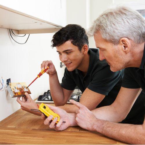 Electricians testing a socket