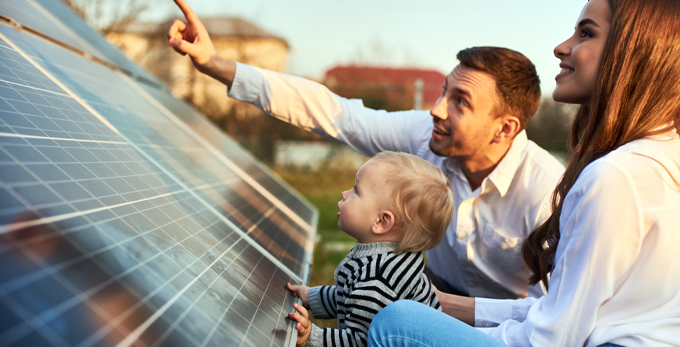 Young family looking happy with the benefits of Solar Energy