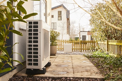 Heat pump attached to house