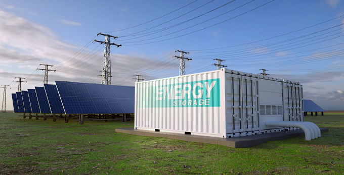 A solar energy battery storage unit, outside on a sunny day, next to solar panels.