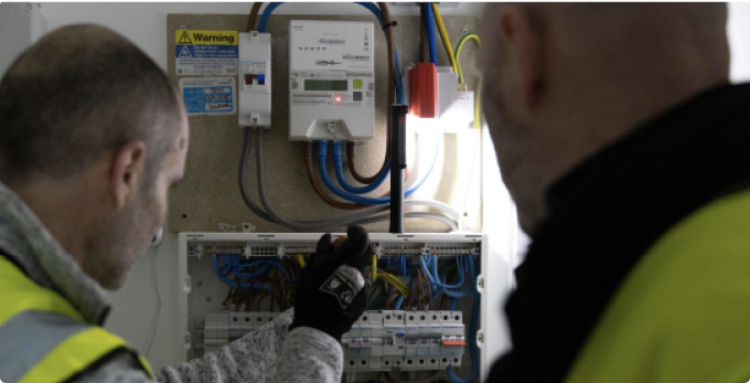 Two NICEIC showing safe practice while working on a consumer unit