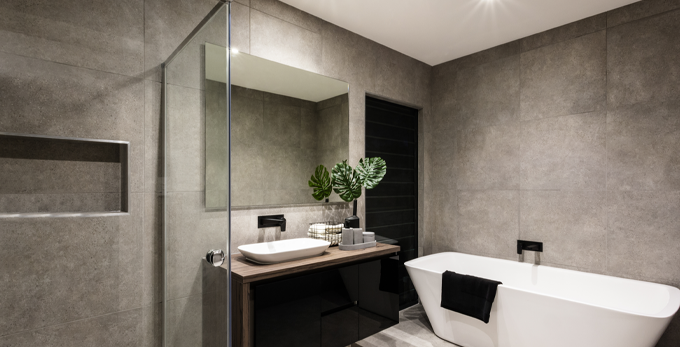Modern bathroom design, showcasing LED mirror and large bath.