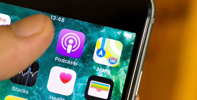 Apple Podcasts icon, shown on a mobile home screen, about to be launched.
